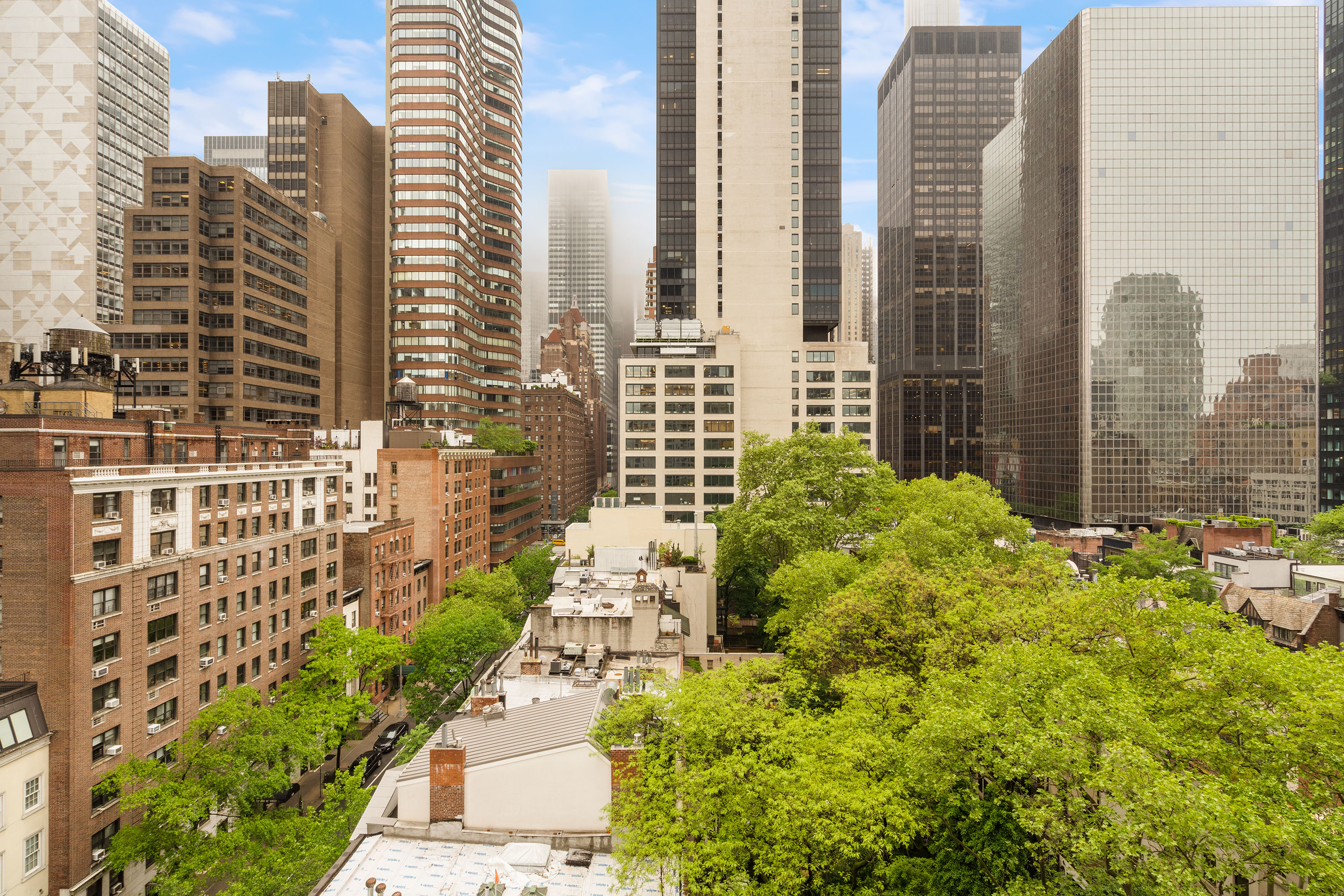 249 East 48th Street, Unit 12A Manhattan, NY 10017 - Photo 5 of 9 a view of a city with tall buildings