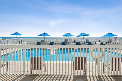 a view of roof deck with dining table and chair