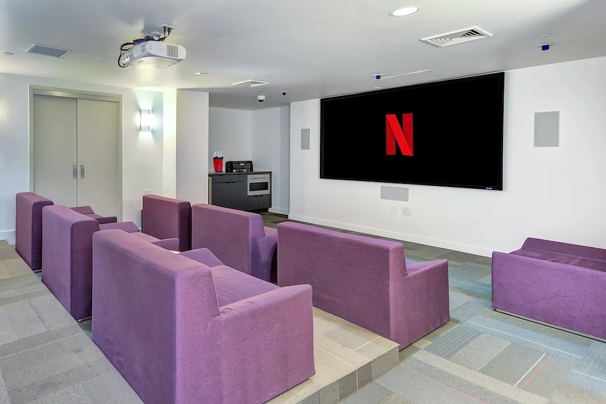 626 Flatbush Avenue, Unit 9H Brooklyn, NY 11225 - Photo 9 of 18 a living room with furniture and a flat screen tv