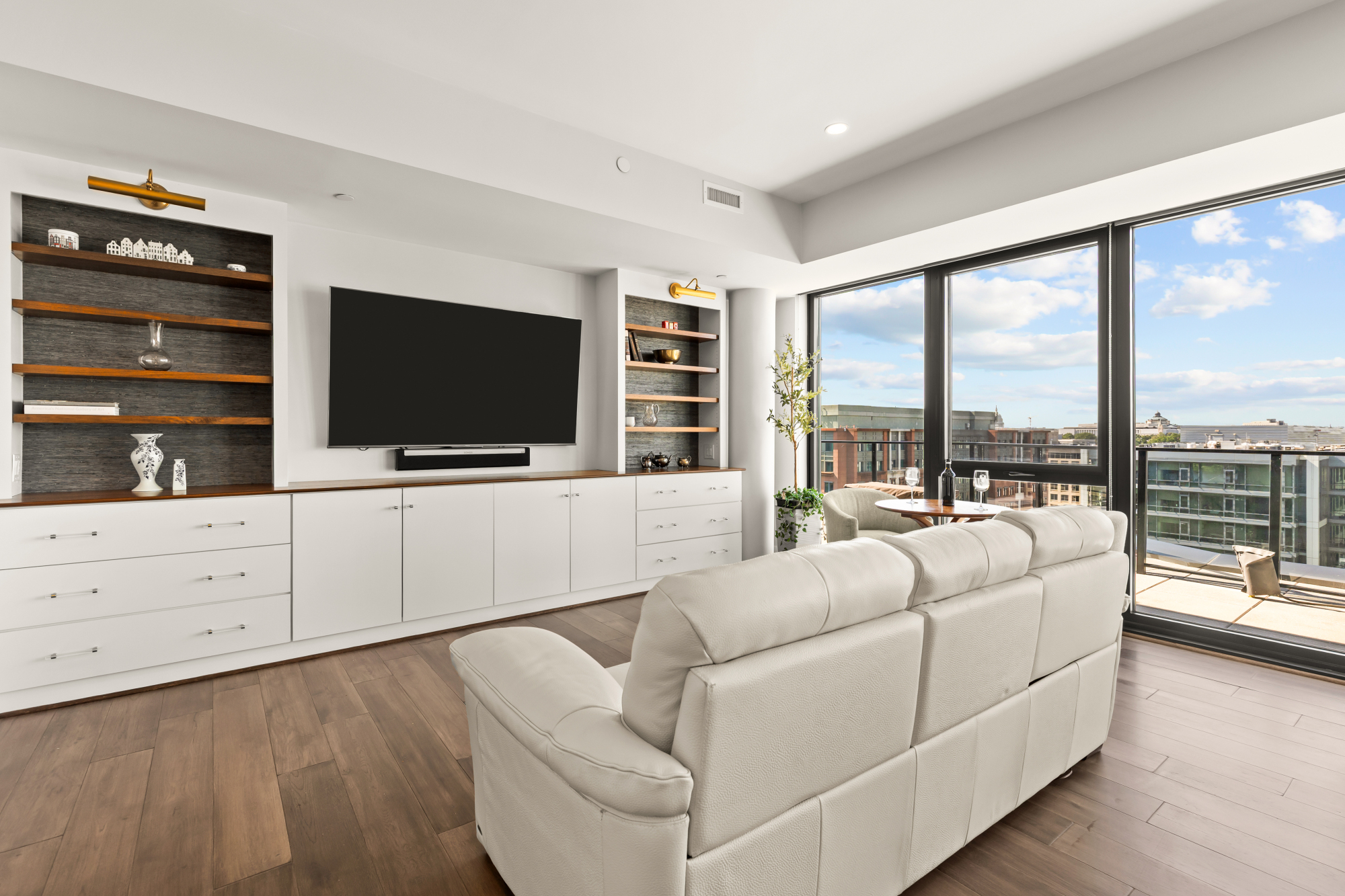 1300 4th Street Southeast, Unit PH02 Washington, DC 20003 - Photo 12 of 38 a living room with furniture and a flat screen tv
