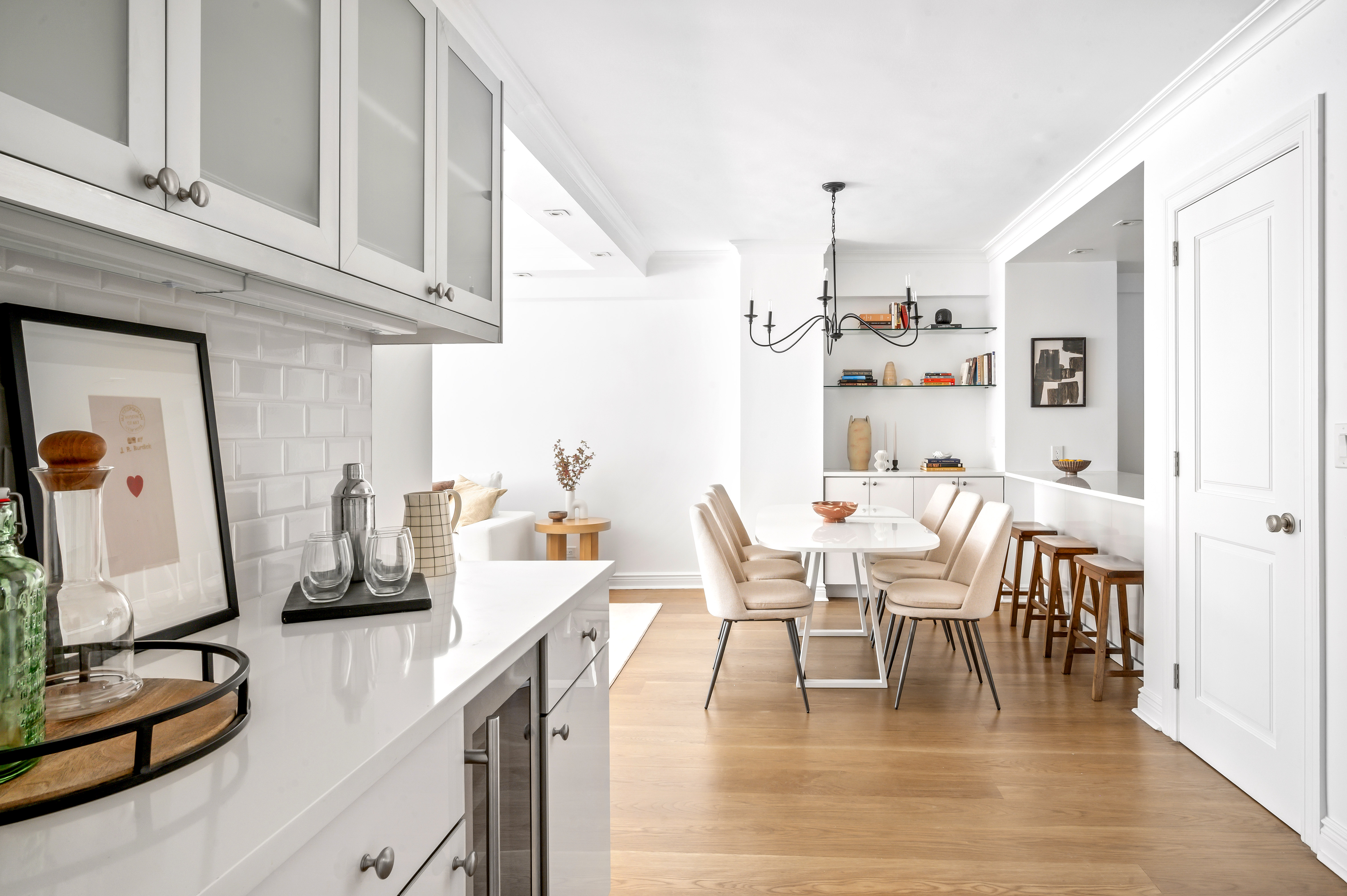 166 East 63rd Street, Unit 2J Manhattan, NY 10065 - Photo 9 of 14 a dining room with furniture and wooden floor
