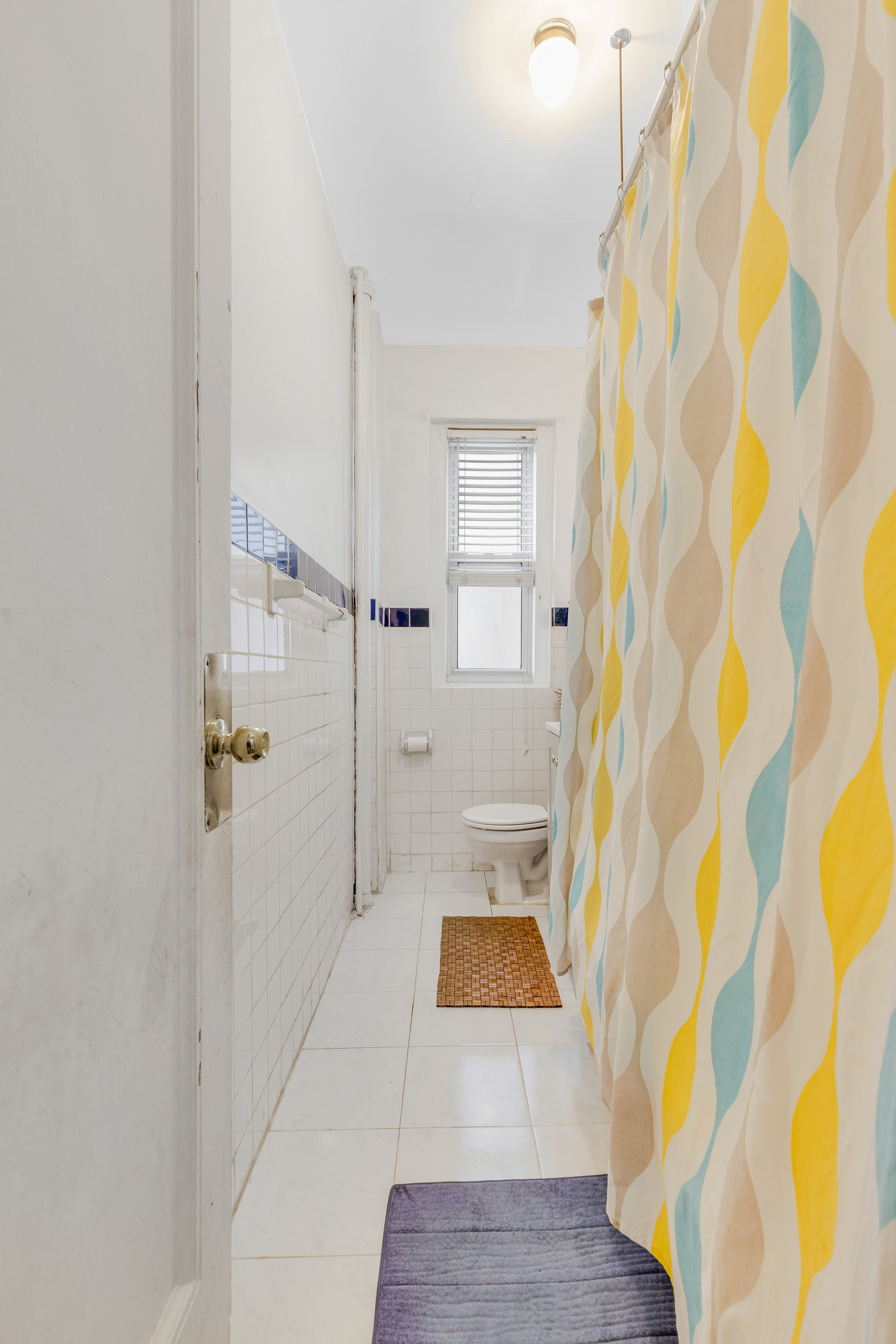 416 Ocean Avenue, Unit 48 Brooklyn, NY 11226 - Photo 4 of 14 a bathroom with a sink and a shower