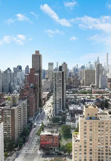 a view of a city with tall buildings