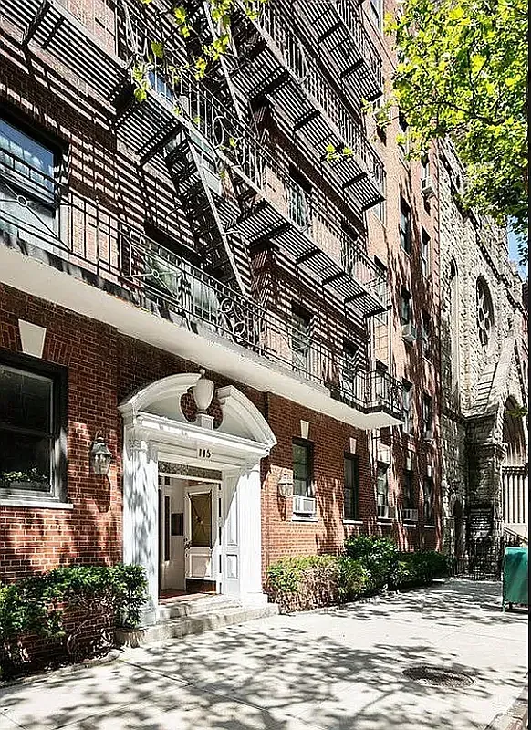 a front view of a building with garden