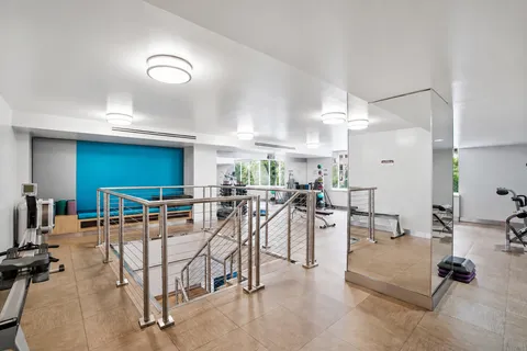 an open kitchen with a table and chairs