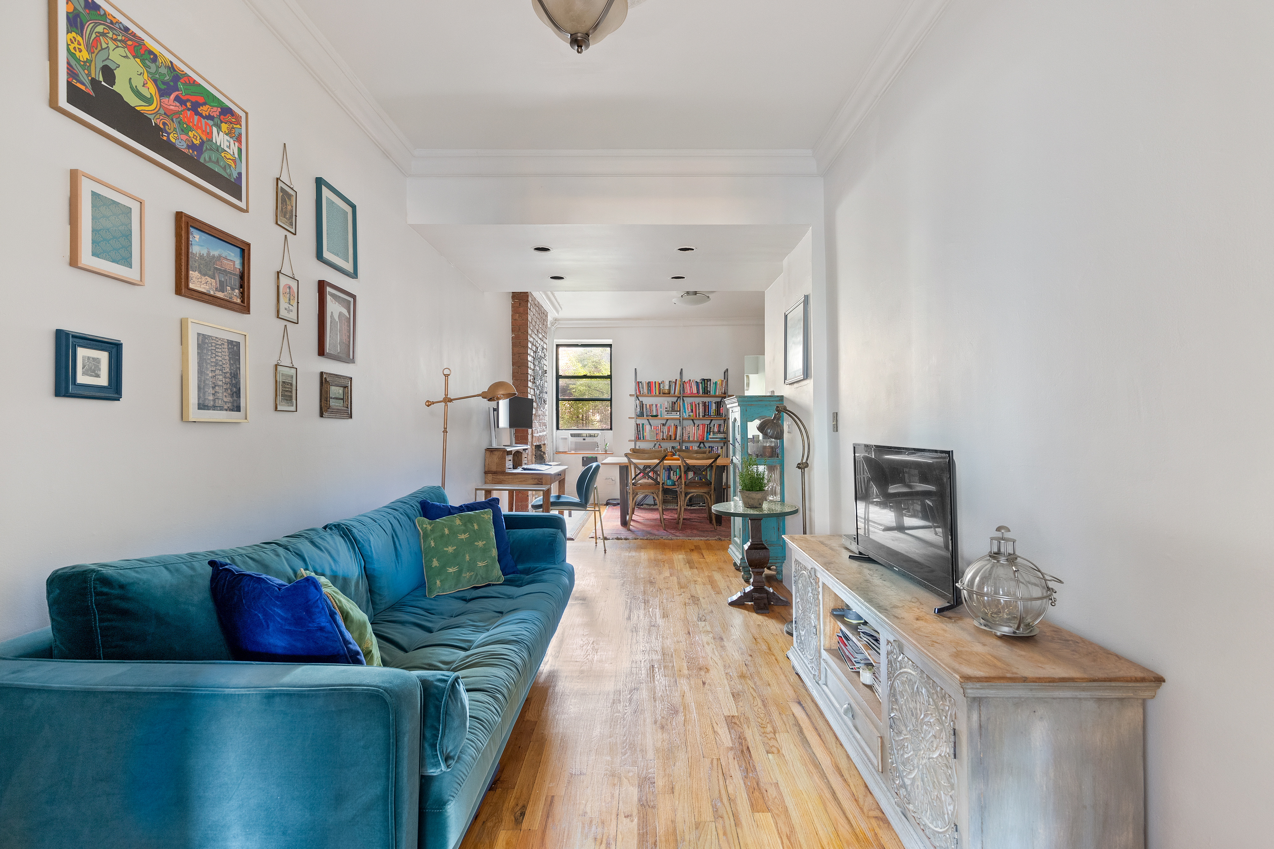 347 5th Avenue, Unit 2L Brooklyn, NY 11215 - Photo 2 of 5 a living room with furniture and a flat screen tv