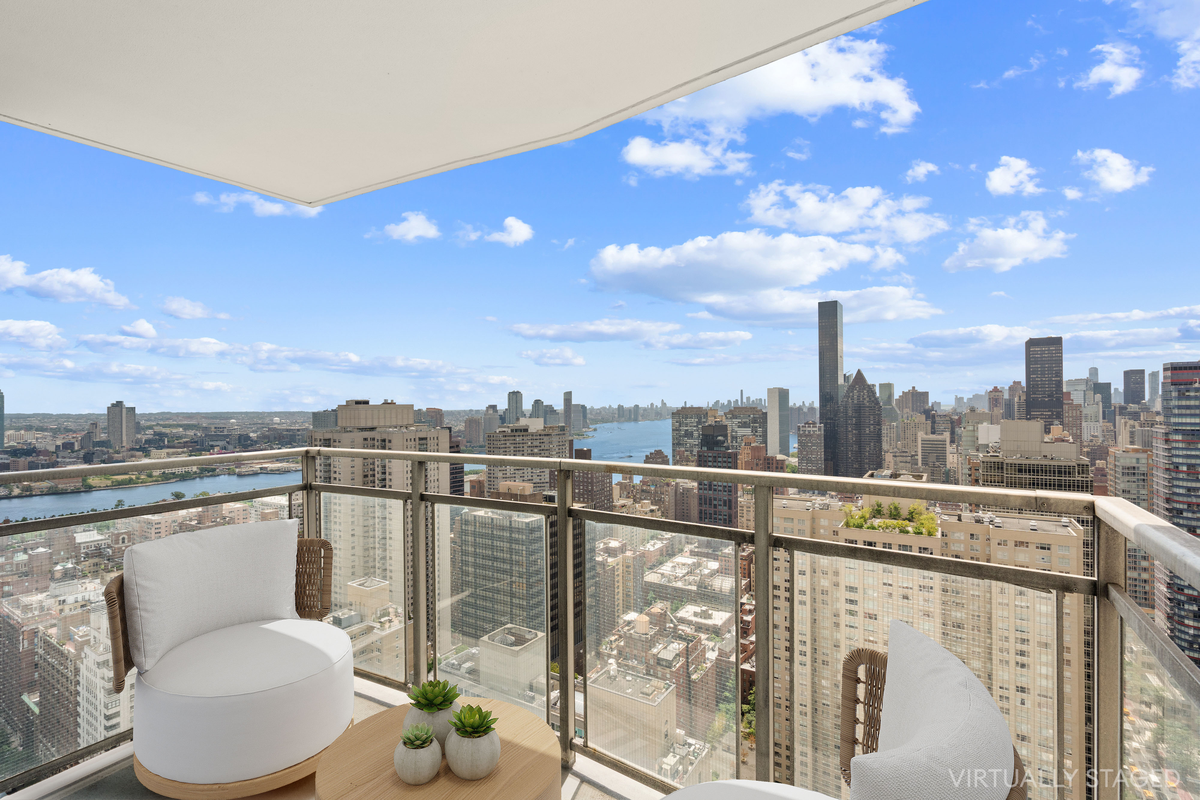 303 East 57th Street, Unit 41G Manhattan, NY 10022 - Photo 3 of 15 a view of a city from a terrace