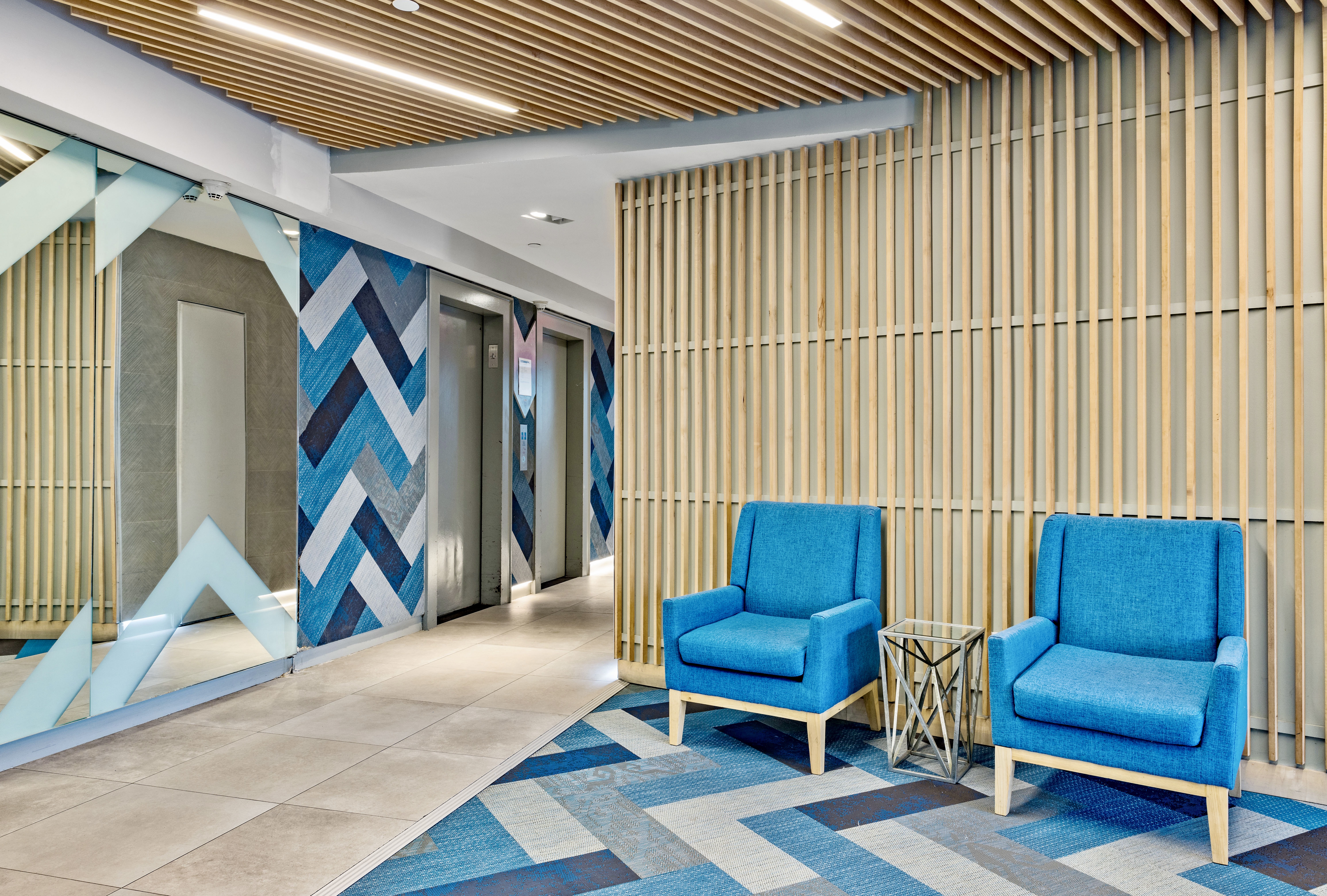 99-72 66th Road, Unit 3R Queens, NY 11374 - Photo 7 of 10 a blue bench sitting in front of a building