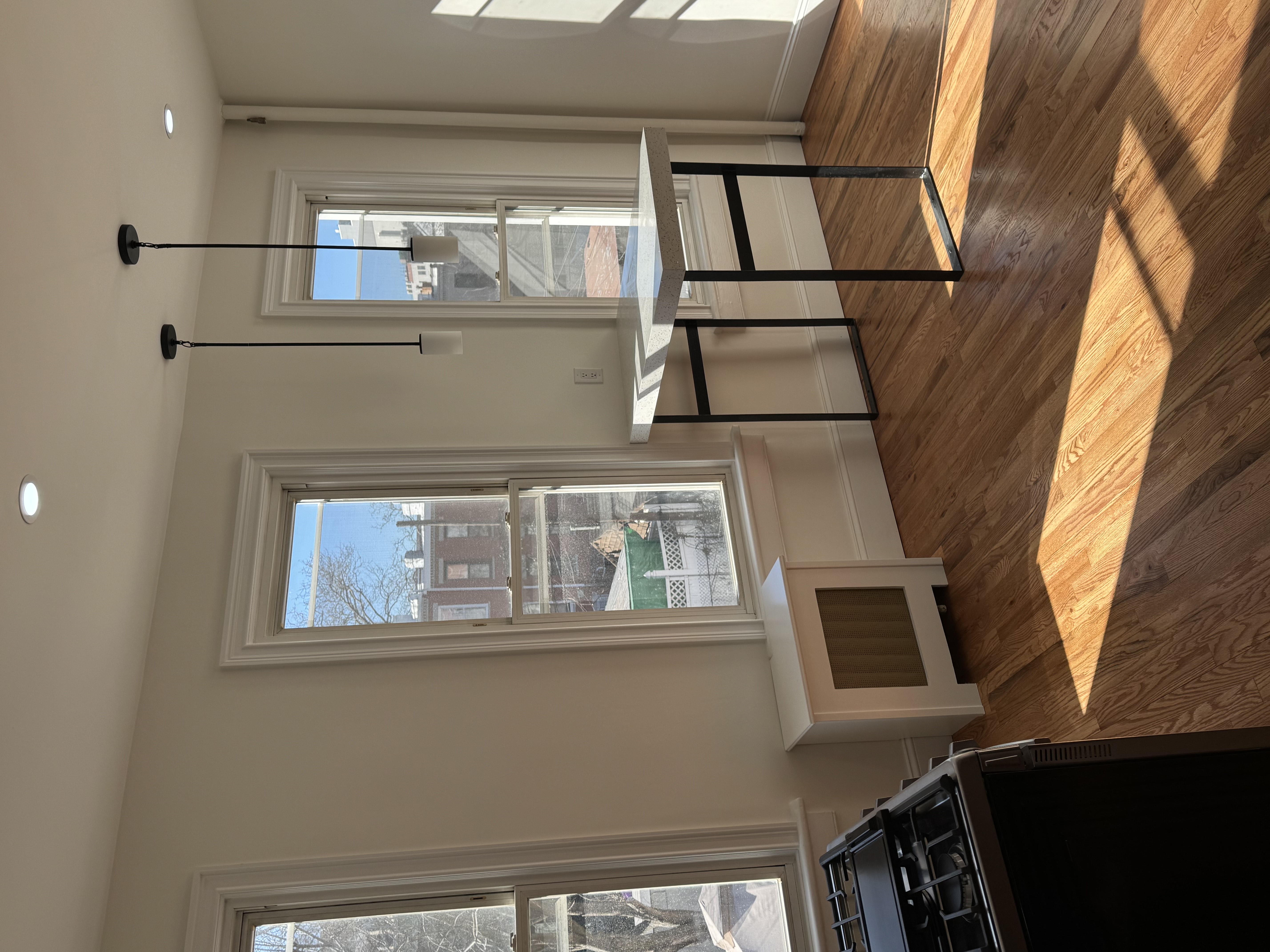 432 36th Street, Unit 2 Brooklyn, NY 11232 - Photo 3 of 11 a workspace with wooden floor and a window