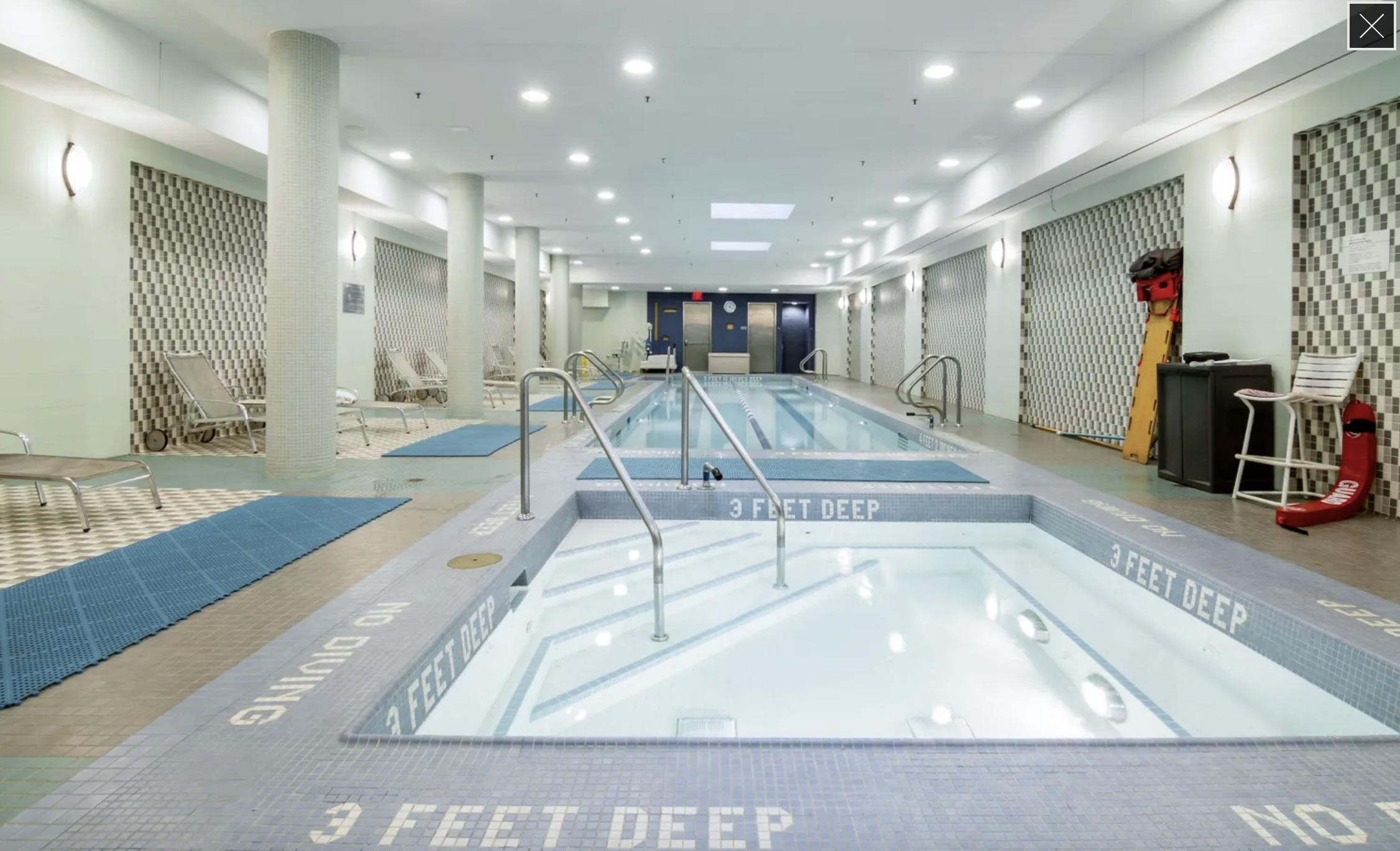 120 Riverside Boulevard, Unit 10W Manhattan, NY 10069 - Photo 12 of 14 a swimming pool with a large mirror and couches