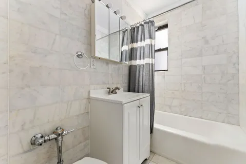 a view of bathroom with bathtub and shower