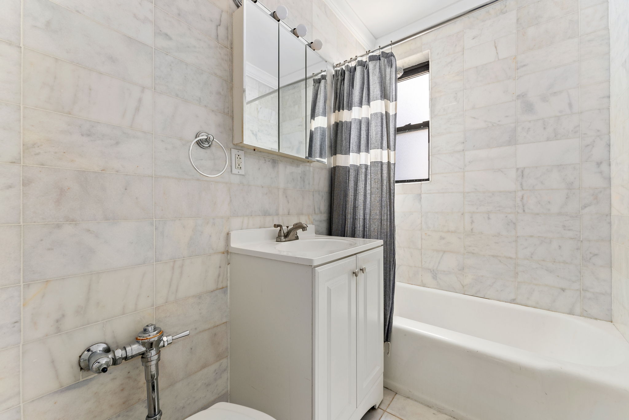 675 Academy Street, Unit 3A Manhattan, NY 10034 - Photo 9 of 12 a view of bathroom with bathtub and shower
