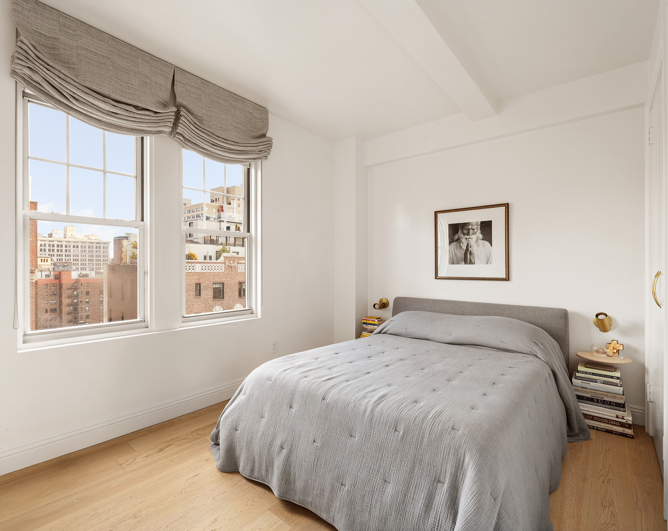 30 5th Avenue, Unit 16H Manhattan, NY 10011 - Photo 3 of 15 a bed sitting in a bedroom next to a window