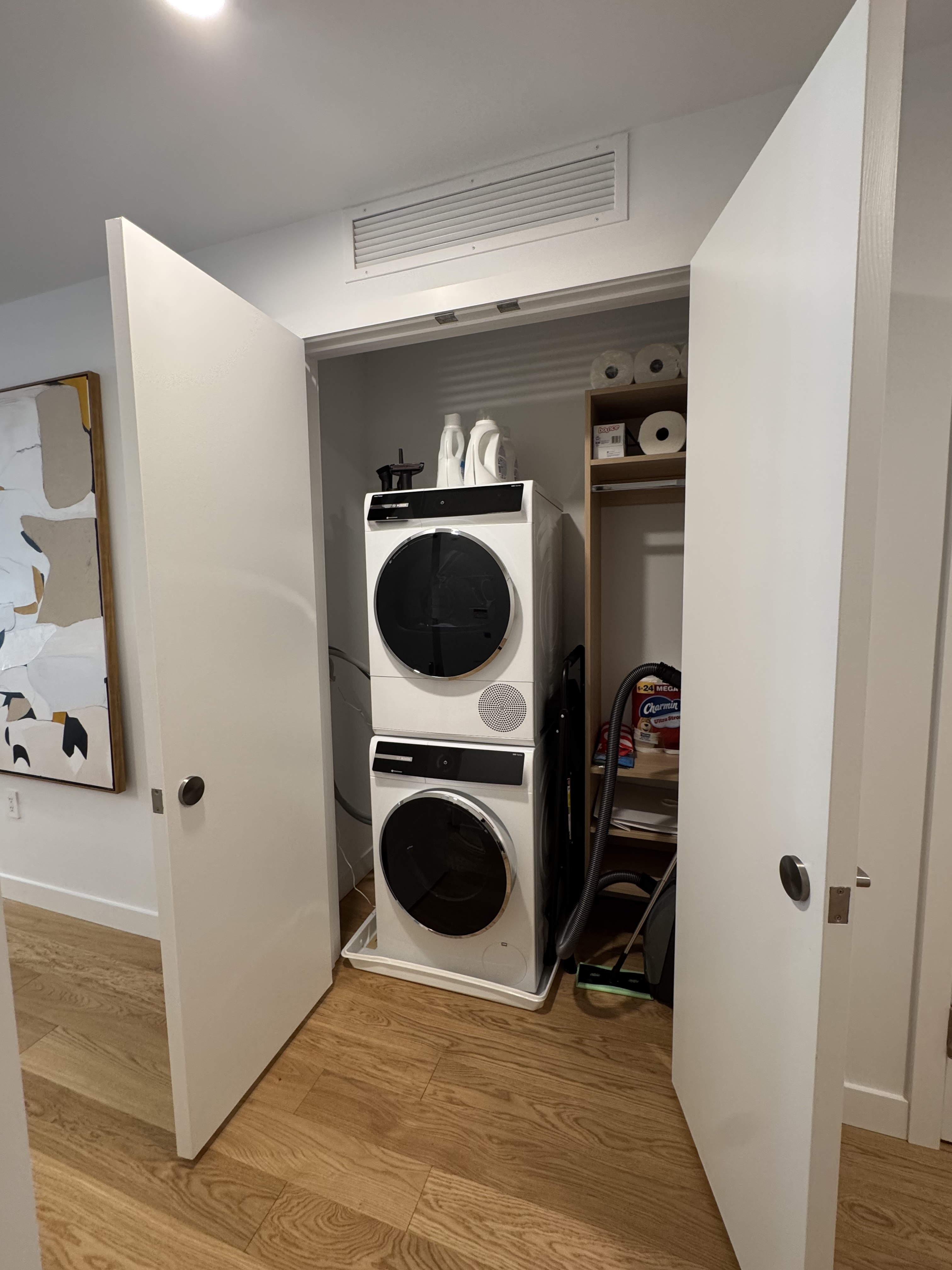 18 West 55th Street, Unit 7B Manhattan, NY 10019 - Photo 16 of 20 a view of a hallway with washer and dryer