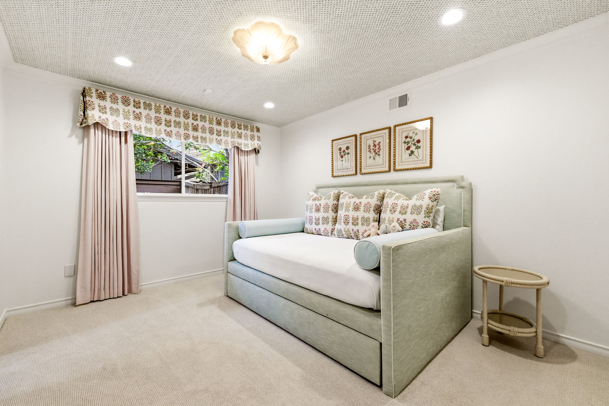 5765 Stonegate Road Dallas, TX 75209 - Photo 25 of 37 a bed room with a bed and a painting