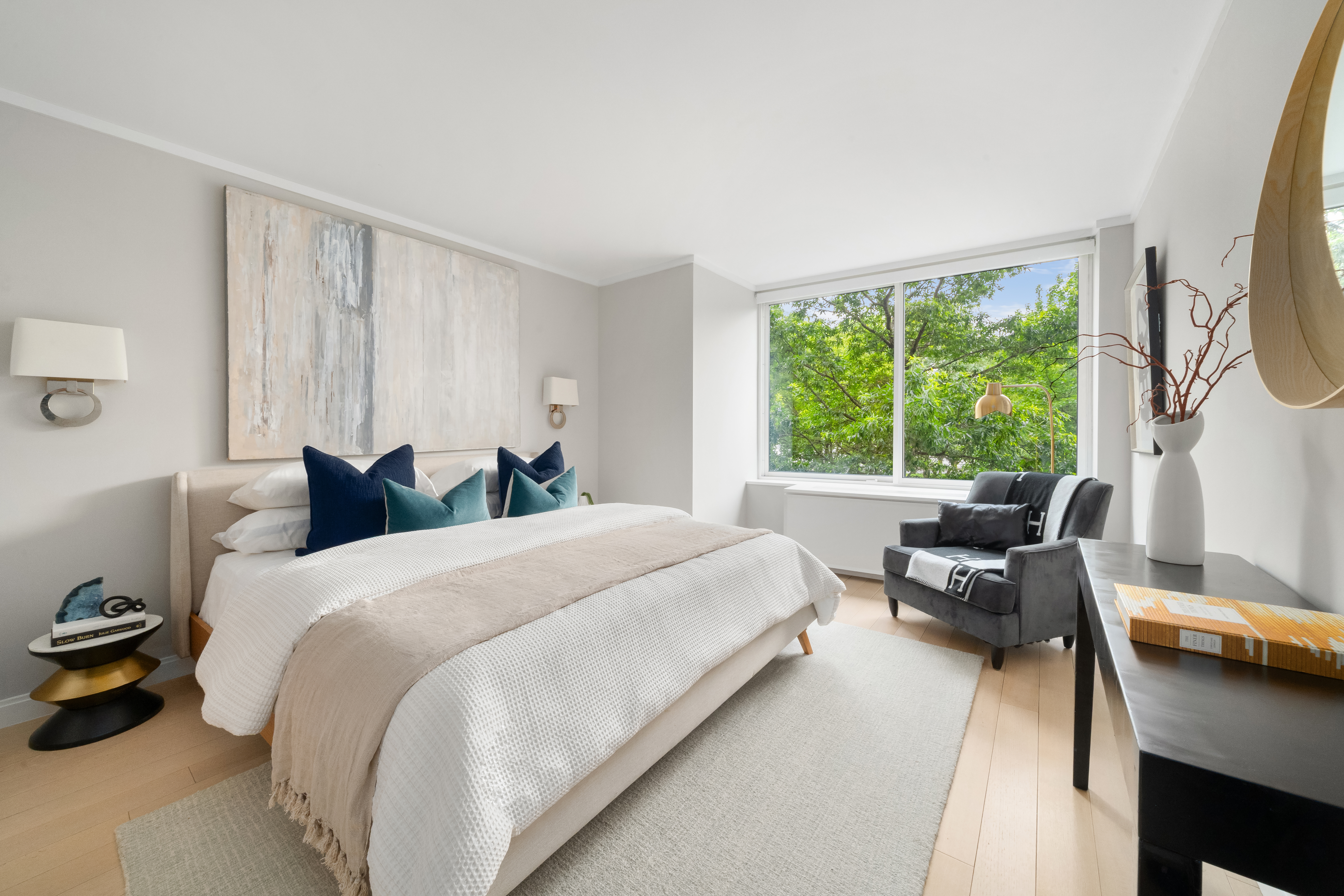 212 Warren Street, Unit 2C Manhattan, NY 10282 - Photo 6 of 21 a bed room with a bed and a chair