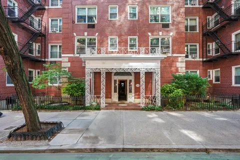 a front view of a building with garden