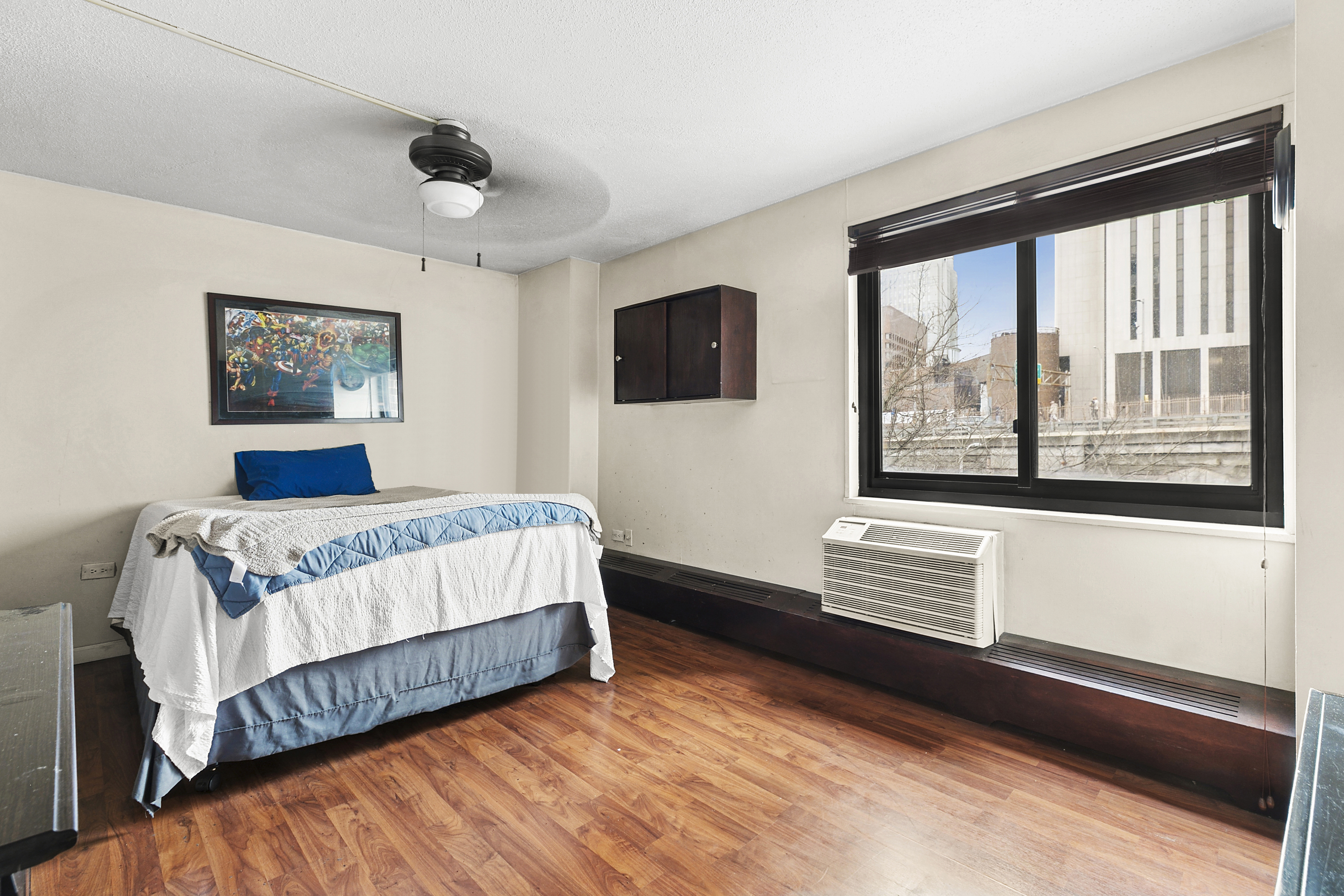 333 Pearl Street, Unit 6K Manhattan, NY 10038 - Photo 6 of 7 a bedroom with a bed and window
