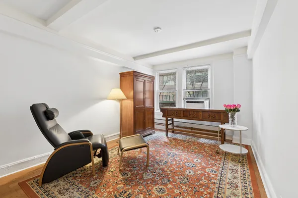 a living room with furniture and a window