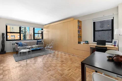 a living room with furniture and a window