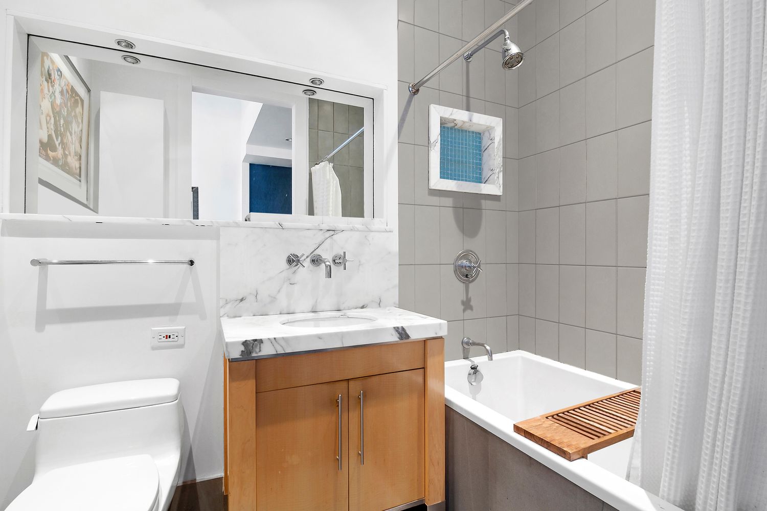 60 Broadway, Unit 2K Brooklyn, NY 11249 - Photo 5 of 7 a bathroom with a sink toilet vanity and shower