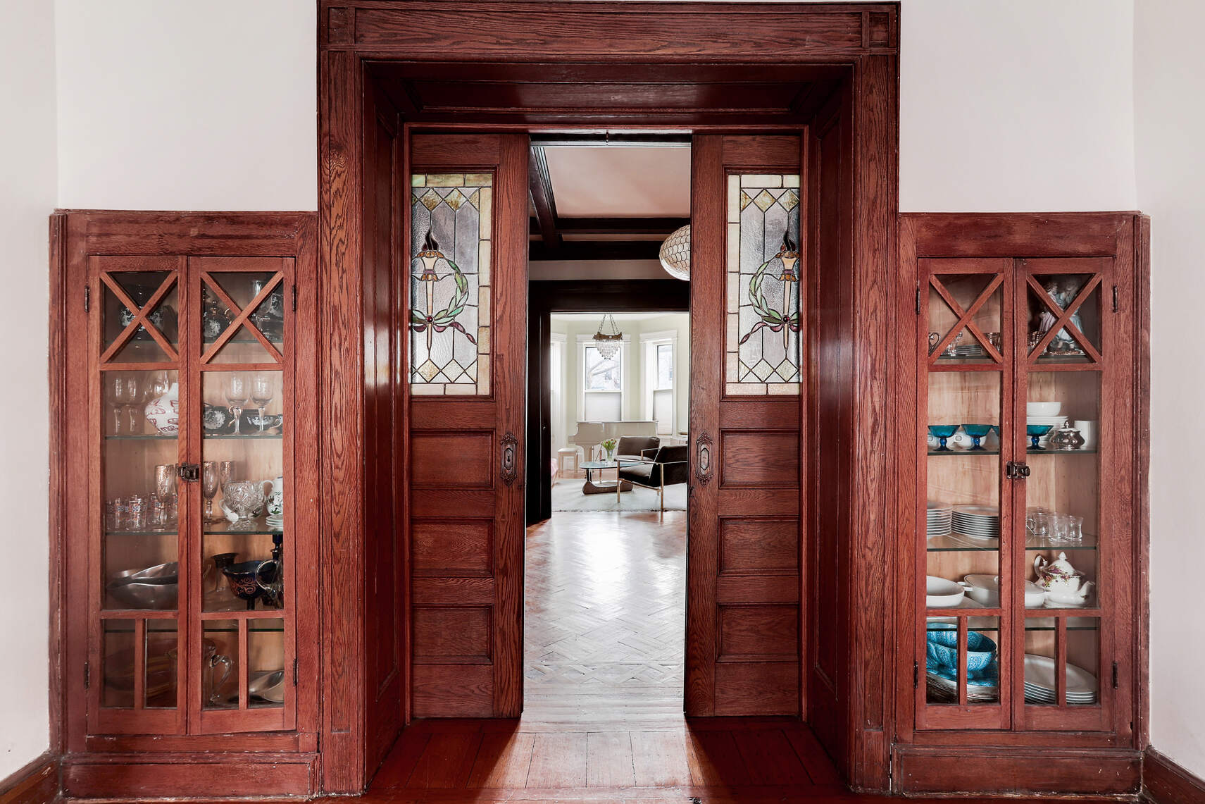 261 Fenimore Street Brooklyn, NY 11225 - Photo 1 of 21 a hallway with wooden floor table and chairs