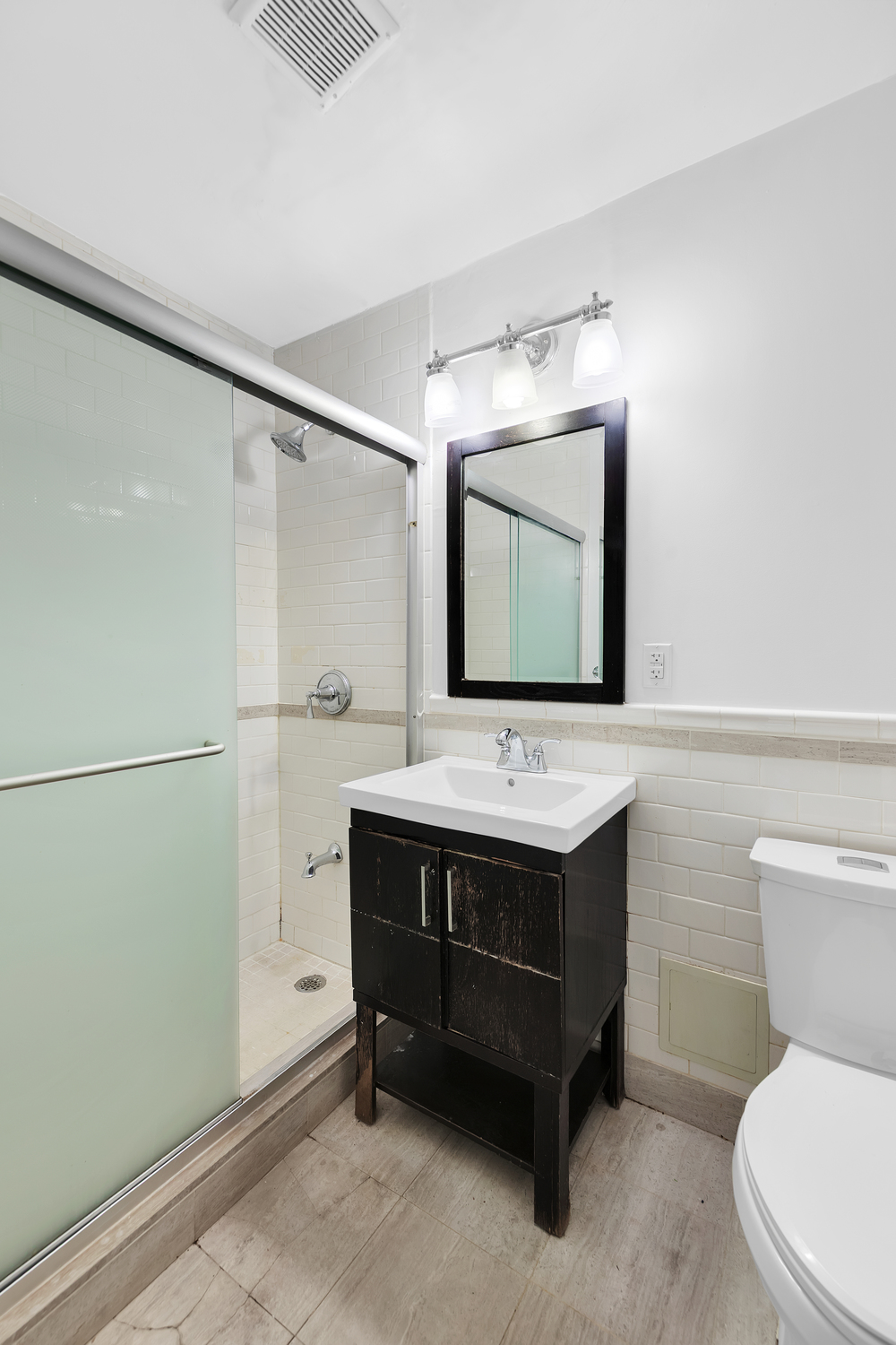 25 Hamilton Terrace, Unit 3F Manhattan, NY 10031 - Photo 5 of 6 a bathroom with a sink toilet and mirror