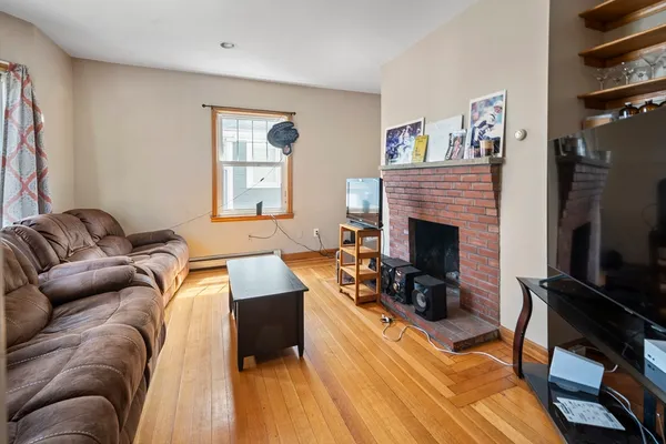 a living room with furniture fireplace and a flat screen tv