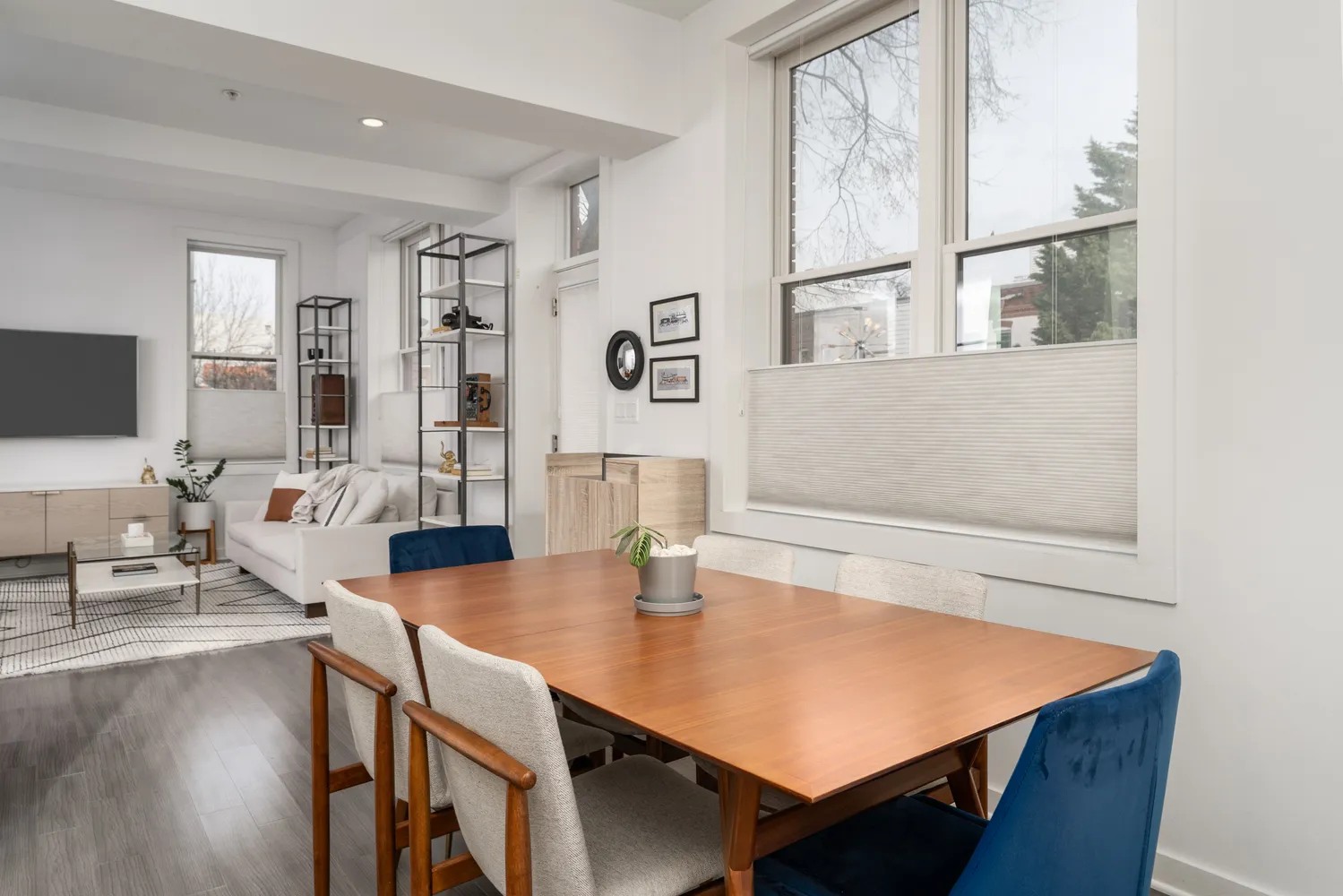 a view of a dining room with furniture and wooden floor