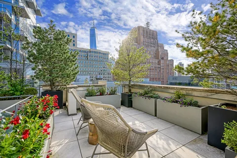 a white toilet sitting next to a bathroom sink