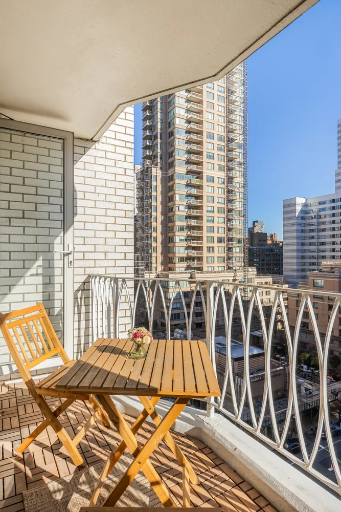 a view of a balcony with a couple of white walls