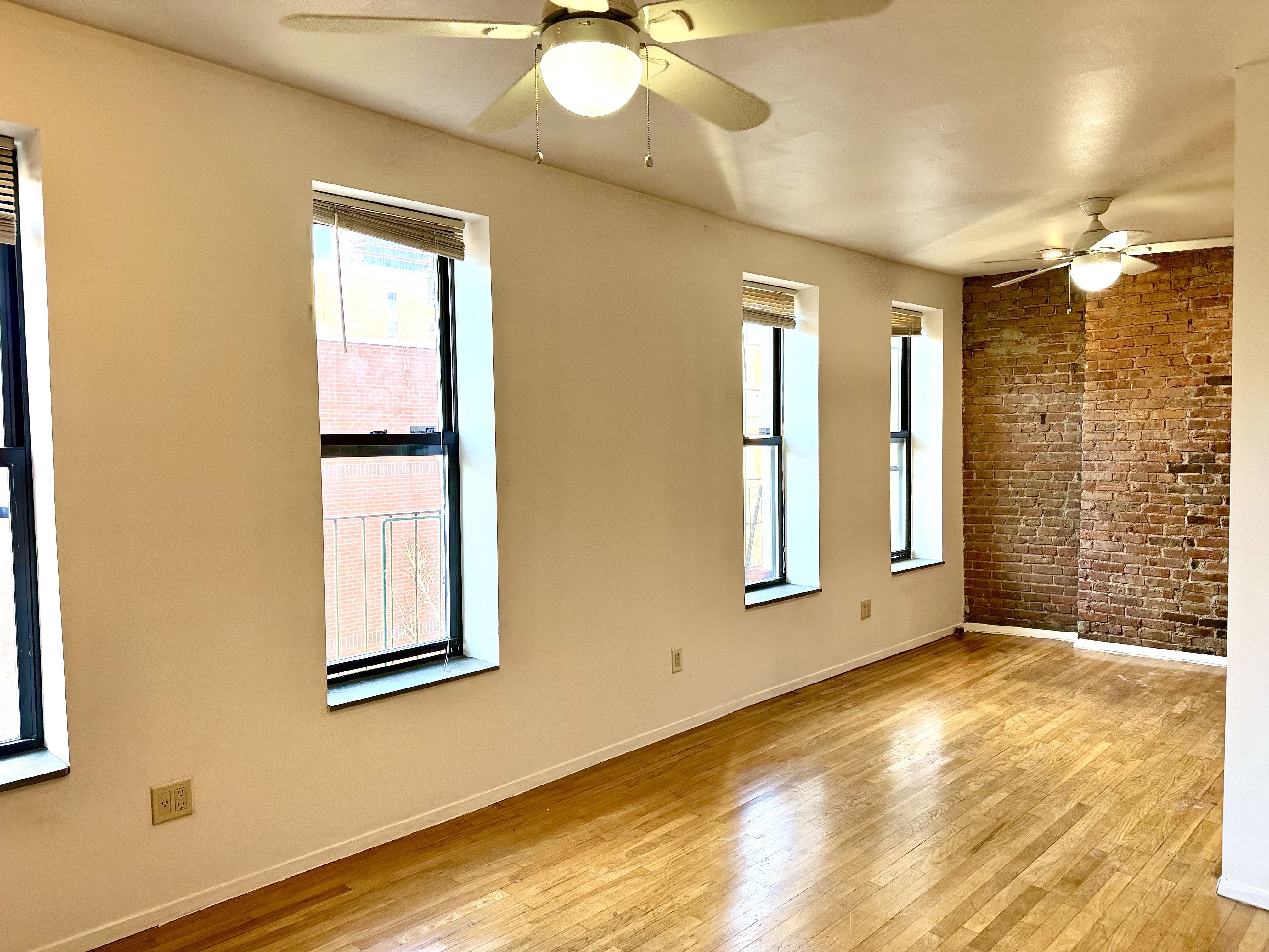 1672 Park Avenue, Unit 4A Manhattan, NY 10035 - Photo 1 of 11 a view of an empty room with a window and bathroom