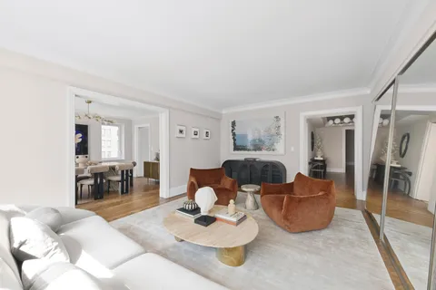 a living room with furniture and a table