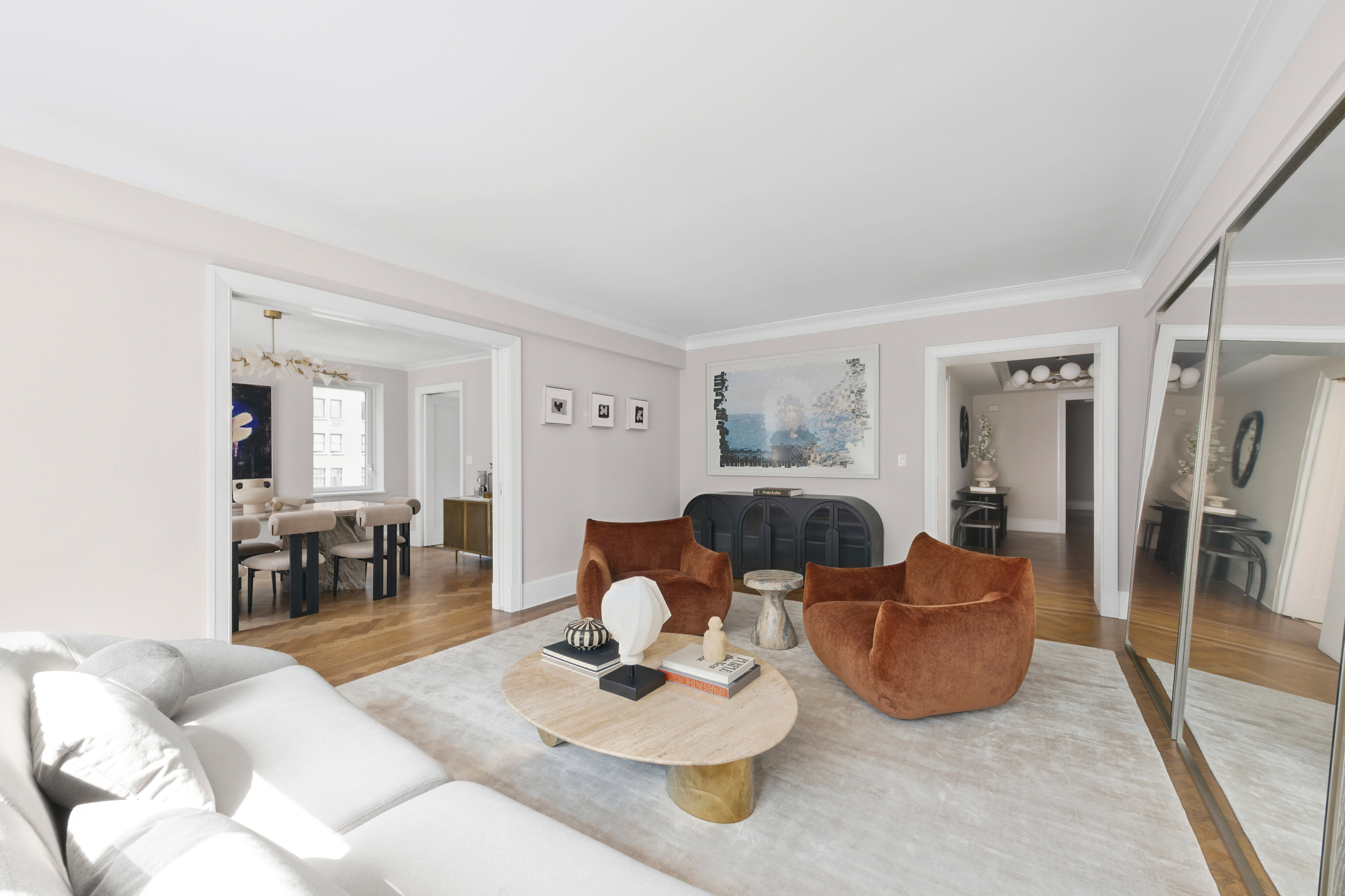 530 Park Avenue, Unit 12A Manhattan, NY 10065 - Photo 2 of 27 a living room with furniture and a table