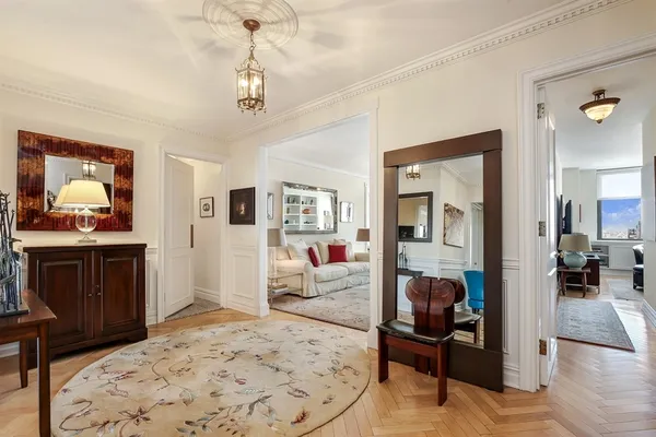 a bedroom with furniture and a chandelier