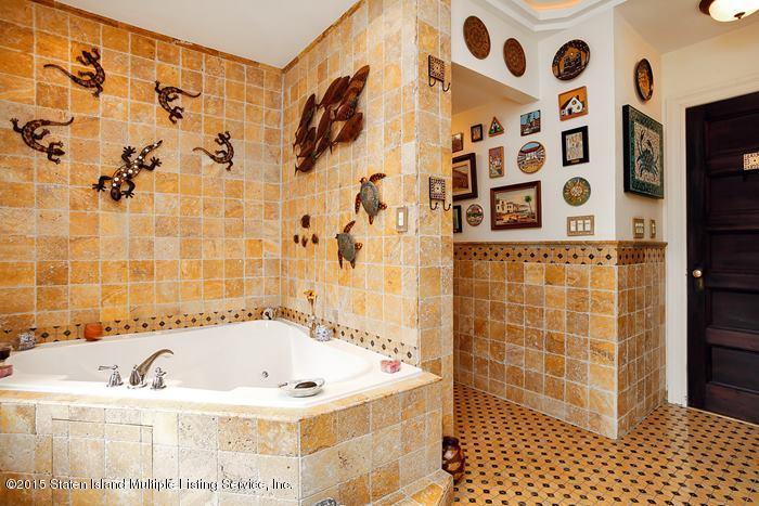 630 East 24th Street Brooklyn, NY 11210 - Photo 15 of 28 a bathroom with a bathtub and shower