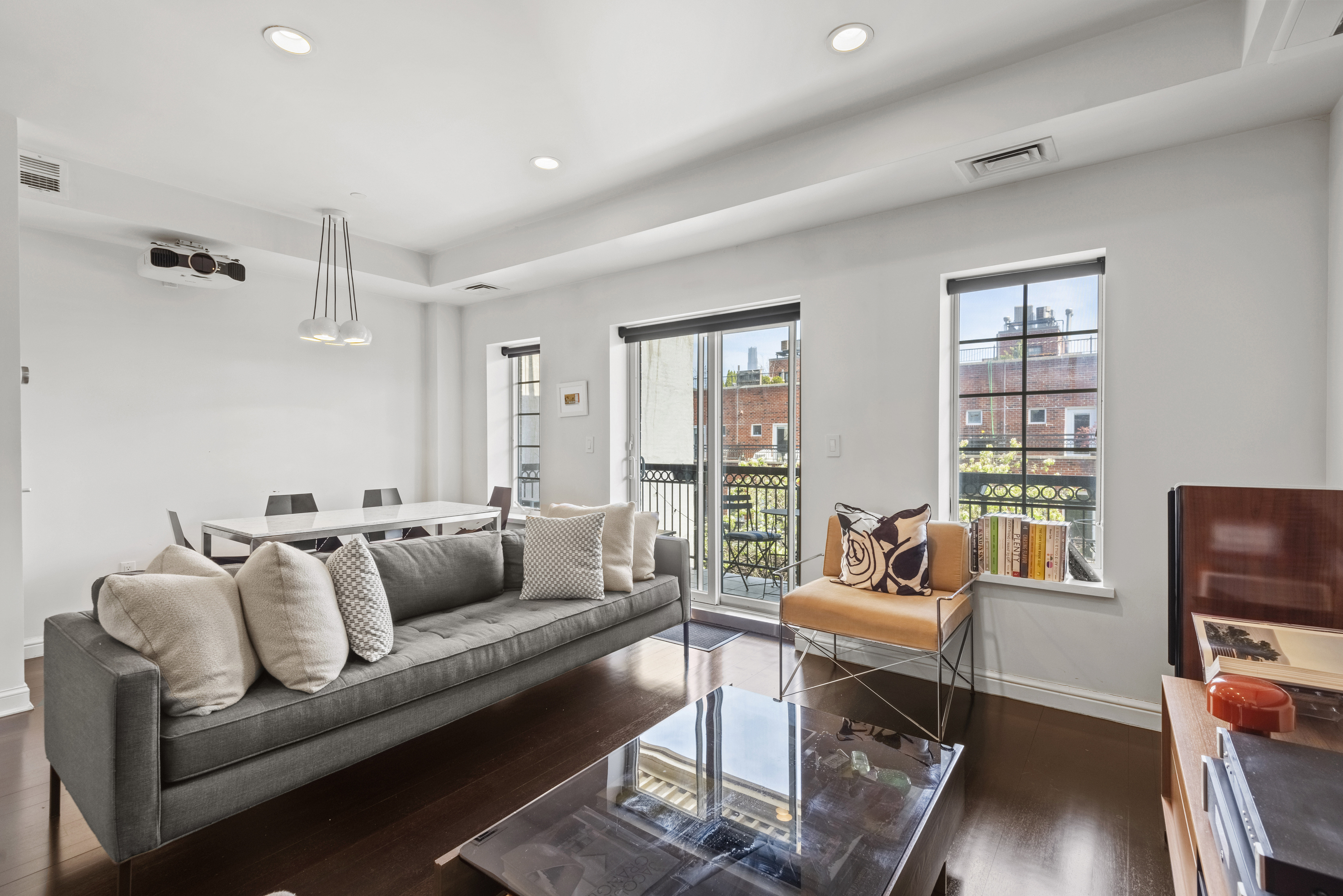 347 3rd Street, Unit C4A Brooklyn, NY 11215 - Photo 3 of 11 a living room with furniture and a window