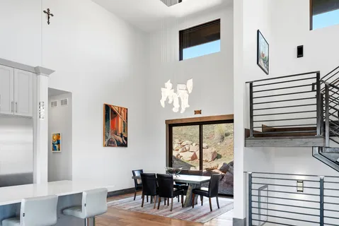 a bathroom with double vanity sinks and a mirror