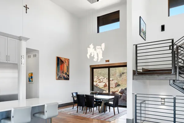 a bathroom with double vanity sinks and a mirror