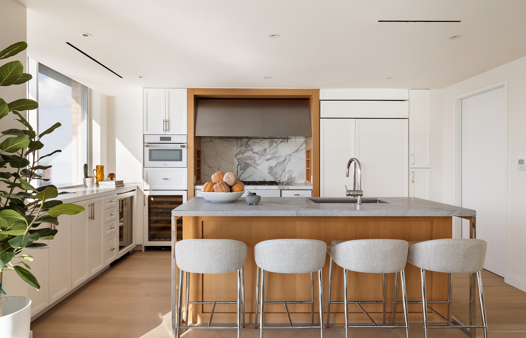 212 Warren Street, Unit PHS Manhattan, NY 10282 - Photo 7 of 18 a kitchen with a table and chairs in it