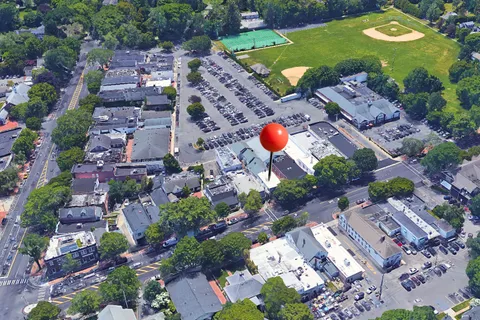 an aerial view of a house with a swimming pool yard and outdoor seating