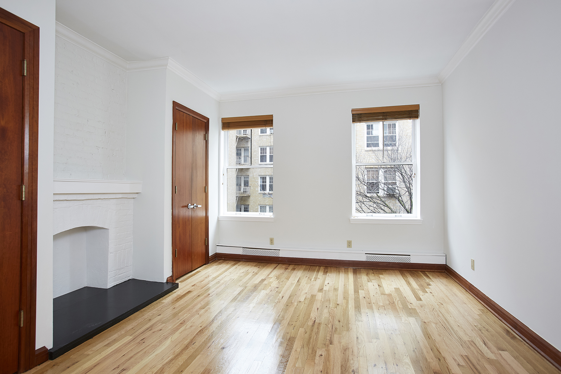 6 Bank Street, Unit 3 Manhattan, NY 10014 - Photo 1 of 6 an empty room with wooden floor and windows