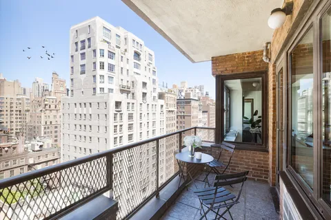 a view of balcony with furniture