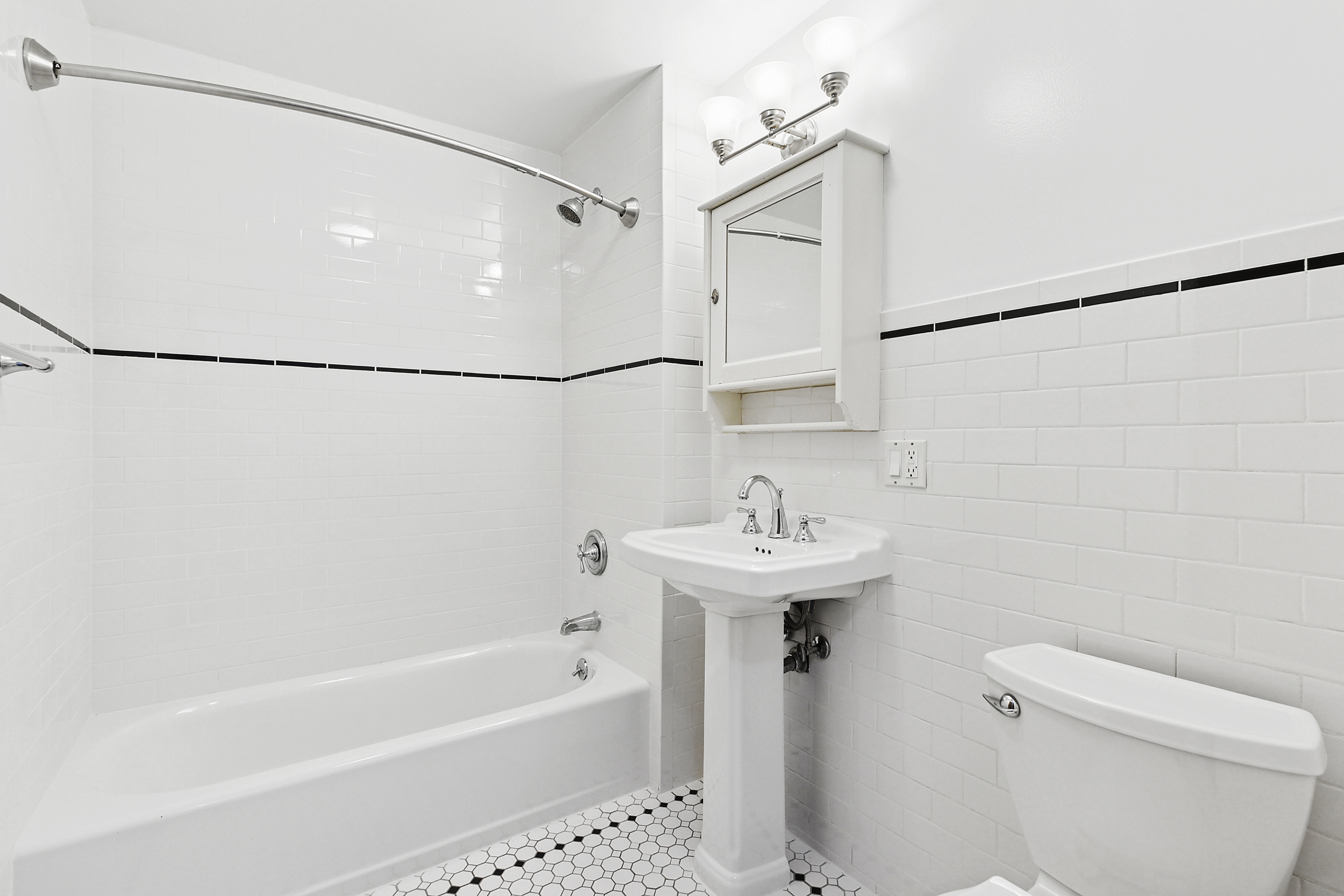 68 Downing Street, Unit 2 Brooklyn, NY 11238 - Photo 3 of 8 a bathroom with a sink a toilet and shower