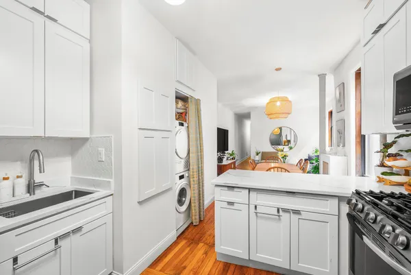 a kitchen with a sink stove and refrigerator