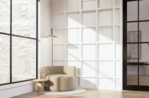 a living room with furniture and a painting on the wall