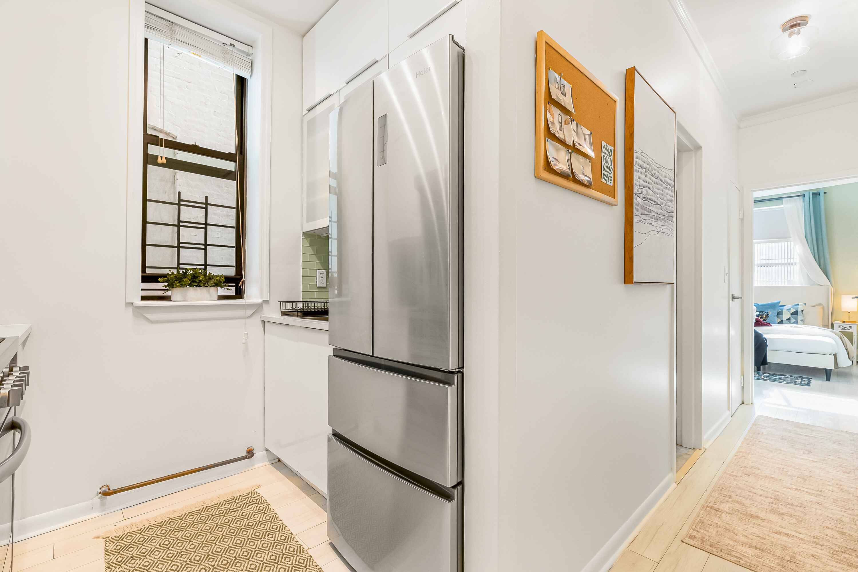 108 West 114th Street, Unit 4B Manhattan, NY 10026 - Photo 8 of 11 a view of walk in closet with wooden floor