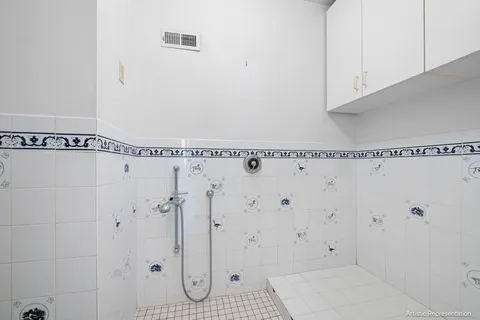 a view of a chair and tables in the balcony