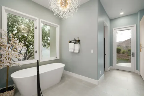 a bathroom with a sink vanity mirror and toilet