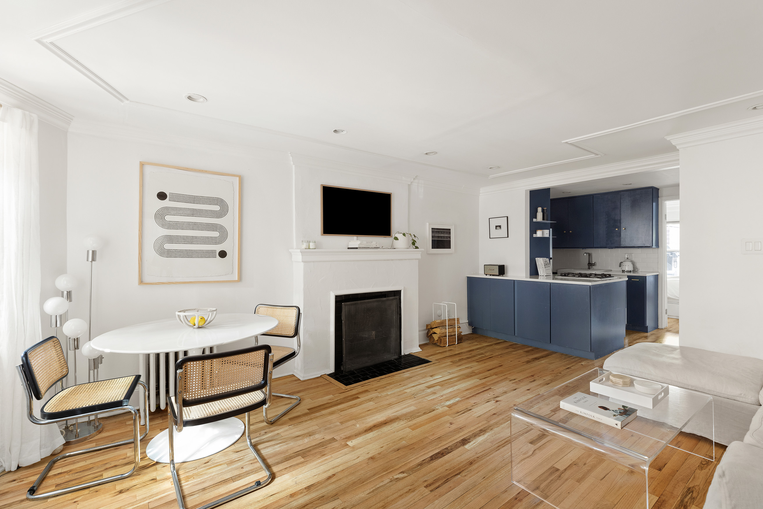 659 Degraw Street, Unit 1 Brooklyn, NY 11217 - Photo 2 of 10 a living room with furniture fireplace and flat screen tv